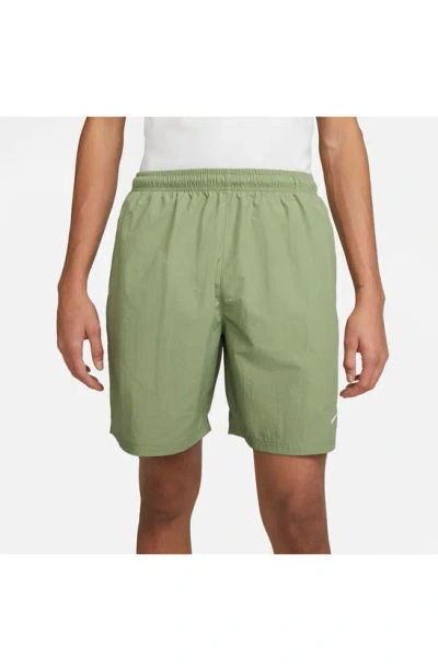 Shop Nike Solo Swoosh Water Repellent Nylon Shorts In Oil Green/ White