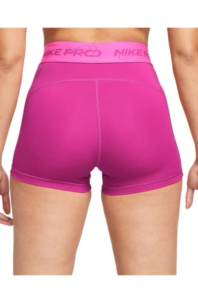 Shop Nike Pro Mid Rise Graphic Training Shorts In Fire Berry/ Laser Fuchsia