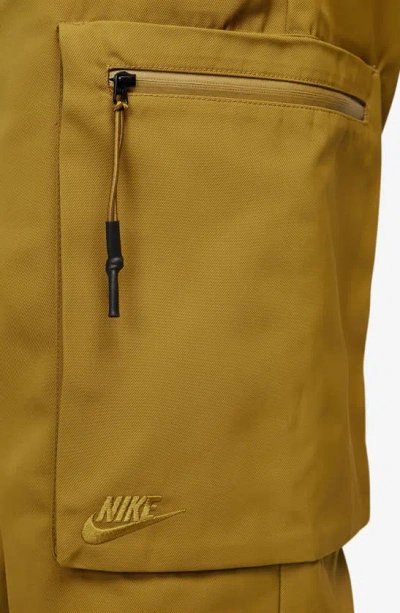 Shop Nike Sportswear Tech Pack Utility Pants In Bronzine/ Black/ Bronzine