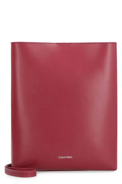 Shop Calvin Klein Leather Crossbody Bag In Burgundy