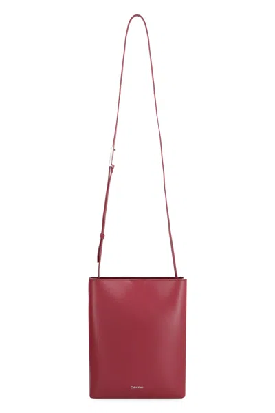 Shop Calvin Klein Leather Crossbody Bag In Burgundy