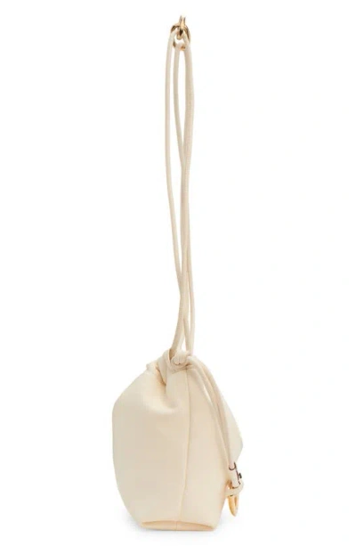 Shop Valentino Mini Vlogo Leather Drawstring Bag In Ivory
