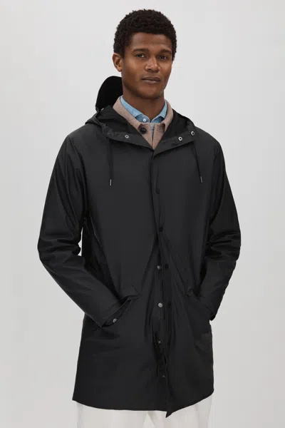 Shop Rains Longline Hooded Raincoat In Black