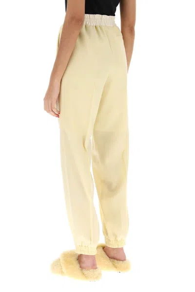 Shop Jil Sander Virgin Wool Jogger Pants Women In Yellow