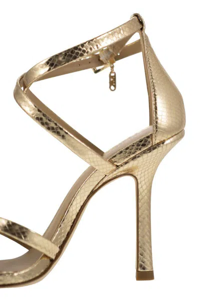 Shop Michael Kors Celia Sandal In Metallic Snake Print Leather In Gold