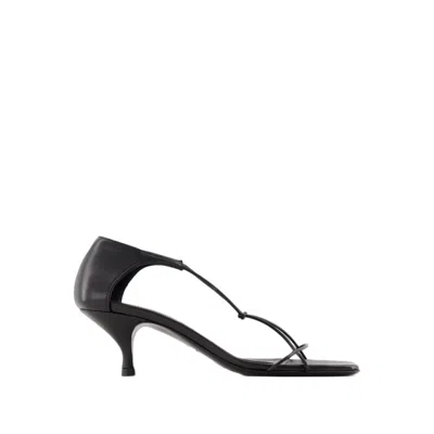 Shop Totême The Knot Sandals - Leather - Black In White