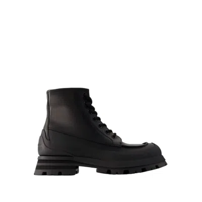 Shop Alexander Mcqueen Tread Ankle Boots - Leather - Black