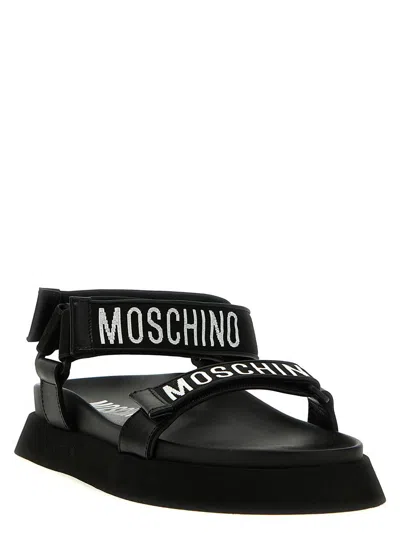 Shop Moschino Logo Sandals In Black