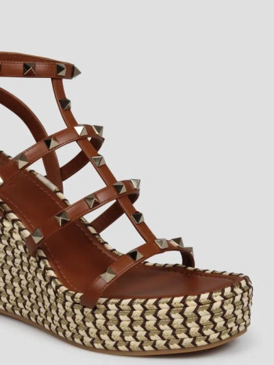 Shop Valentino Rockstud Wedge Sandal In Brown