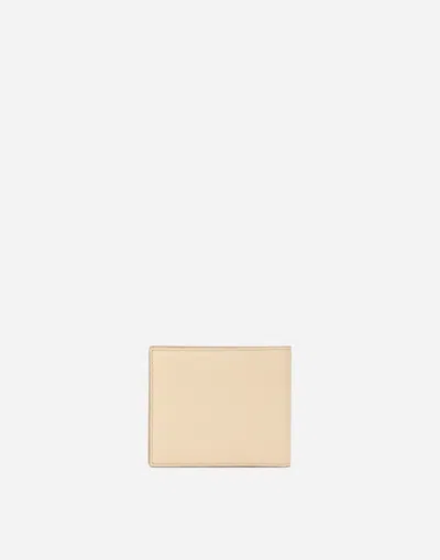 Dolce & Gabbana Dg Logo Bifold Wallet In Beige