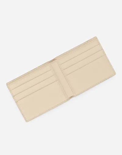 Dolce & Gabbana Dg Logo Bifold Wallet In Beige