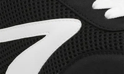 Dolce Vita Bynx Sneaker In Black White