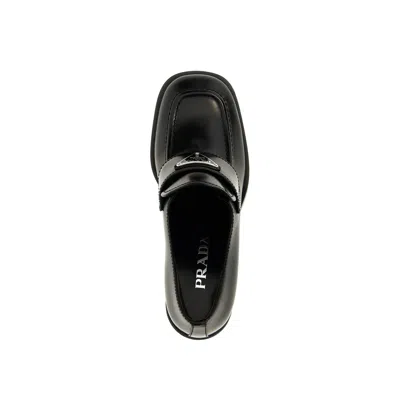 Shop Prada Leather Logo Loafers In Black