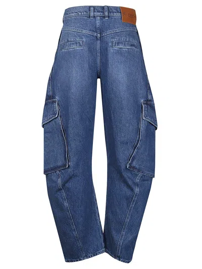 Shop Jw Anderson Logo Patch Tapered Jeans In Blue