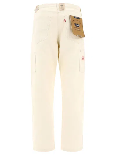 Shop Levi's "568™ Carpenter" Trousers In White