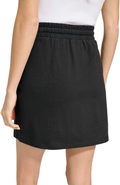 Shop Andrew Marc Twill Faux Wrap Skirt In Black