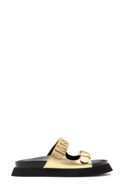 Shop Moschino Metallic Leather Slide Sandal In Gold