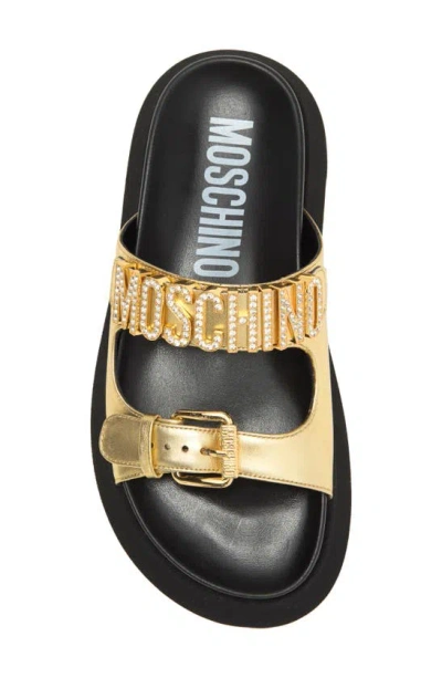 Shop Moschino Metallic Leather Slide Sandal In Gold