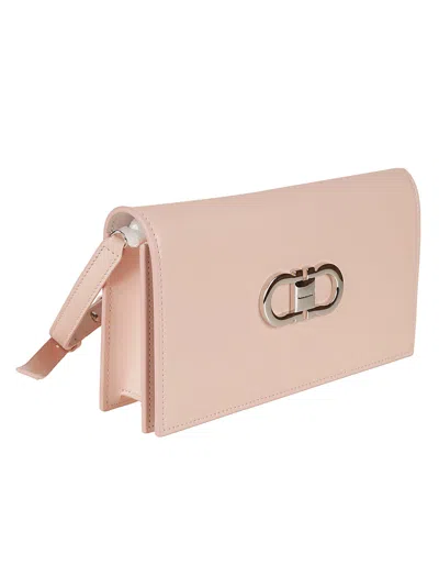Shop Ferragamo Gancini Plaque Shoulder Bag In Pink/optic White