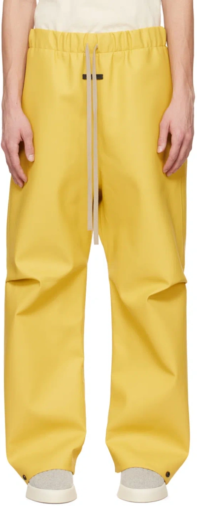 Shop Fear Of God Yellow Rubberized Trousers In Tuscan
