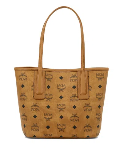 Shop Mcm "reversible Liz" Shoulder Bag In Brown