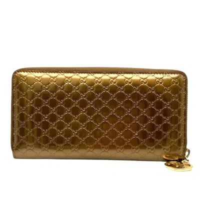 Shop Gucci Gold Patent Leather Wallet  ()