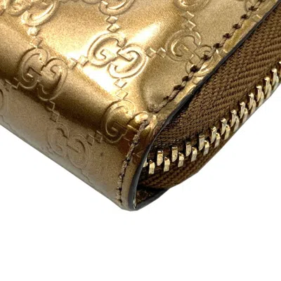 Shop Gucci Gold Patent Leather Wallet  ()