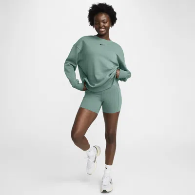 Shop Nike Women's Universa Medium-support High-waisted 5" Biker Shorts With Pockets In Green