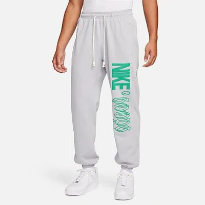 Shop Nike Men's Standard Issue Dri-fit Graphic Basketball Pants In Wolf Grey/stadium Green