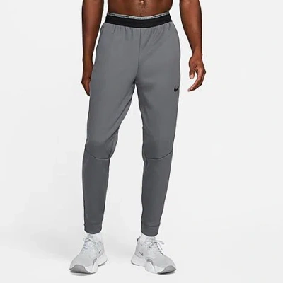 Shop Nike Men's Therma Sphere Therma-fit Fitness Pants In Iron Grey/black/black