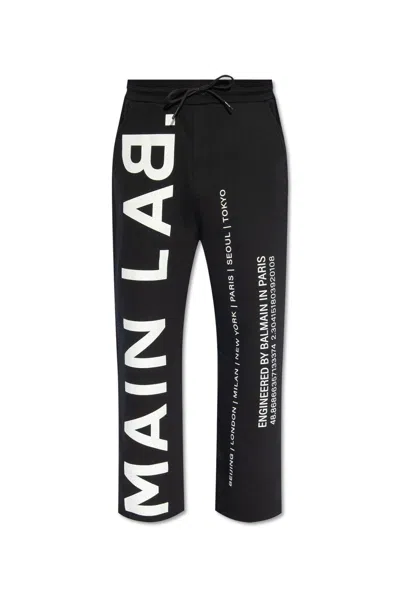 Shop Balmain Logo Printed Track Trousers In Black