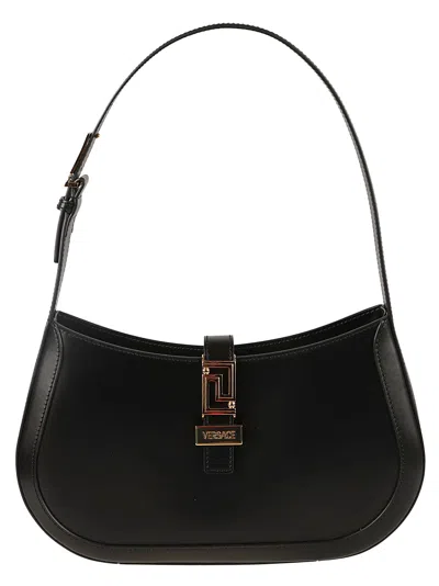 Shop Versace Logo Flap Shoulder Bag In Black