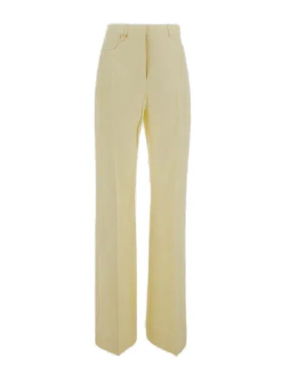 Shop Jacquemus High Waisted Flared Pants In Yellow