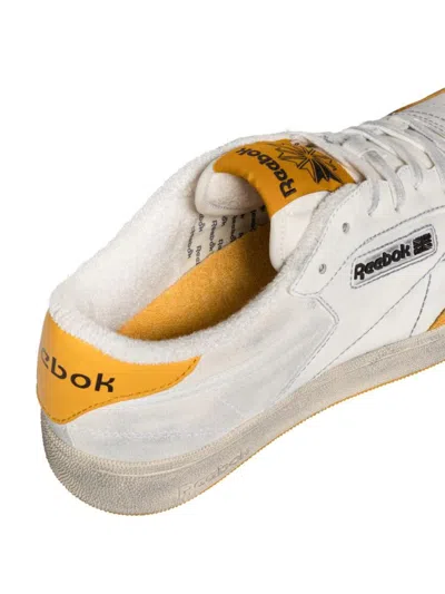Shop Reebok Vintage Club C Sneakers In White