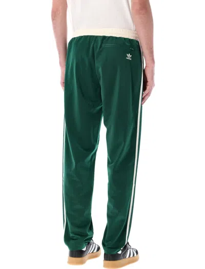 Shop Adidas Originals Sst Track Pants In White/green