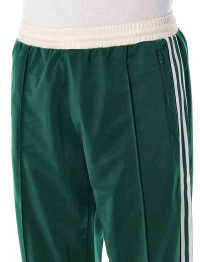 Shop Adidas Originals Sst Track Pants In White/green