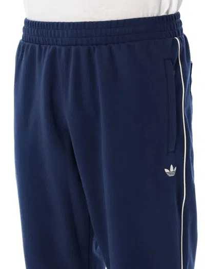 Shop Adidas Originals Poly Track Pants In Navy Cream