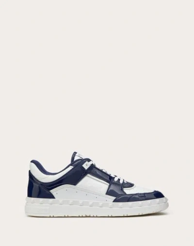 Shop Valentino Garavani Freedots Low Top Sneaker In Patent Leather In Blue/white