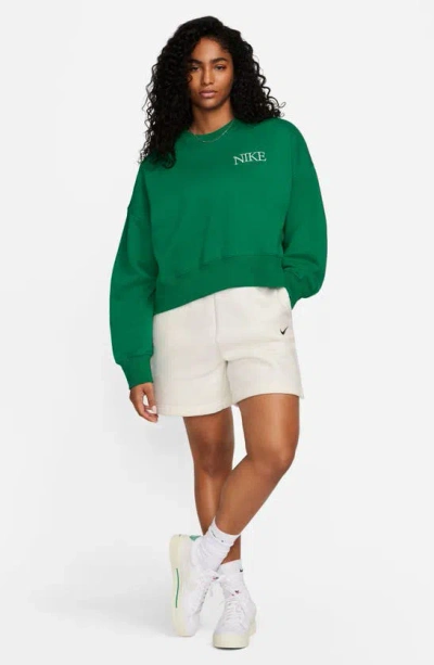 Shop Nike Phoenix Fleece Varsity Oversize Crewneck Sweatshirt In Malachite
