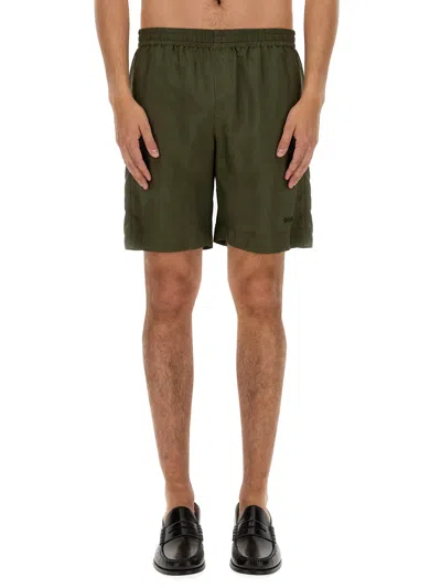 Shop Msgm Cupro Bermuda Shorts In Green