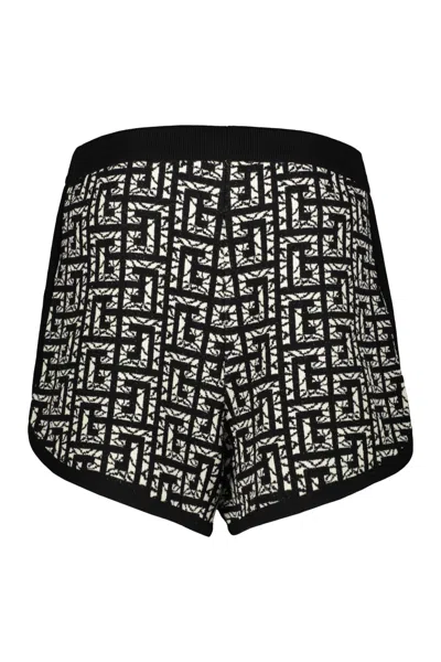 Shop Balmain Bermuda Shorts With All-over Logo In Black