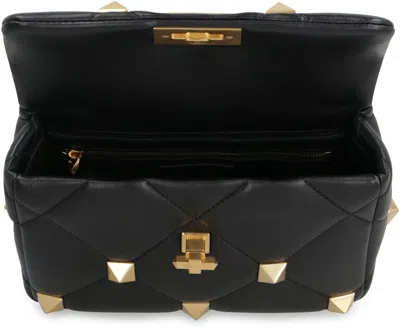 Shop Valentino Garavani - Roman Stud Quilted Leather Bag In Black