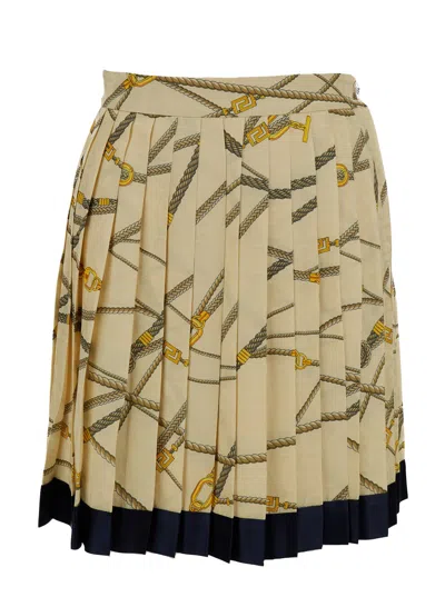 Shop Versace Pale Yellow Pleated Mini Skirt With All-over Logo Print In Silk Blend Woman