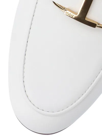 Shop Tod's Flat Shoes In White