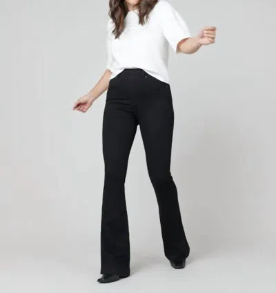 Shop Spanx Flare Jeans In Clean Black