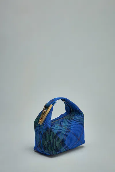 Shop Burberry Mini Peg Duffle Bag