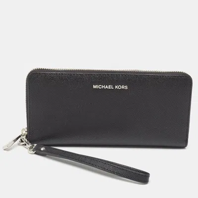 Shop Michael Kors Leather Jet Set Zip Around Continental Wallet In Black