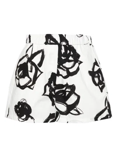 Shop Msgm Cotton Shorts With Floral Print In Black