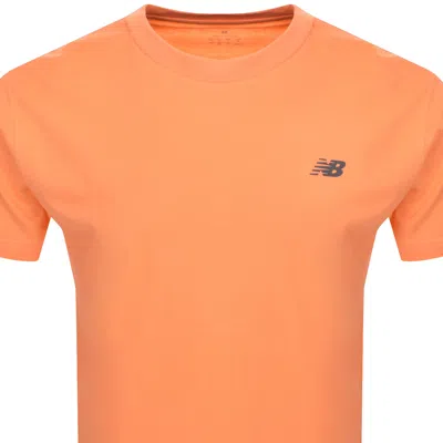 Shop New Balance Sport Essentials Logo T Shirt Orange