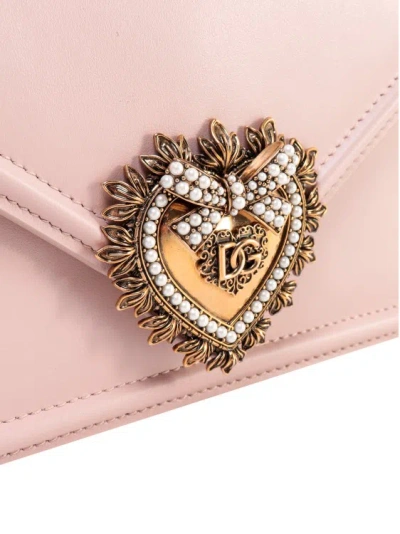Shop Dolce & Gabbana Leather Shoulder Bag With Frontal Cuore Sacro Detail In Pink